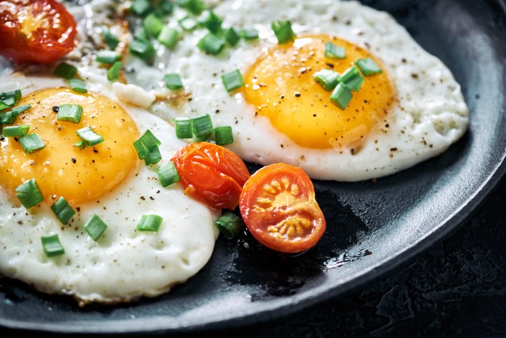 Eggs and toppings on a plate